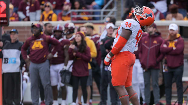 Nov 6, 2021; Minneapolis, Minnesota, USA; Illinois Fighting Illini defensive lineman Jer'Zhan Newton (94) reacts to a missed stop in the third quarter at Huntington Bank Stadium.